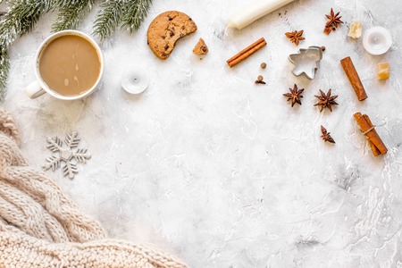 white knitted scarf and christmas decorations top view.の写真素材