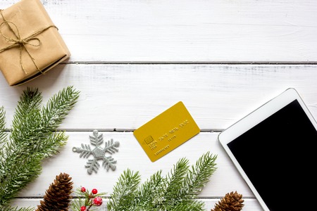 online shopping christmas with e-tablet at wooden background top viewの写真素材