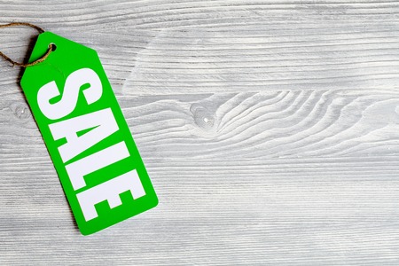 concept of sale on dark wooden background top view.の写真素材