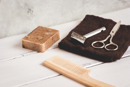 Mens hairdressing wooden desktop with tools close upの写真素材