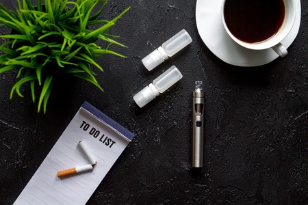 concept of electronic cigarette on dark background top view.の写真素材