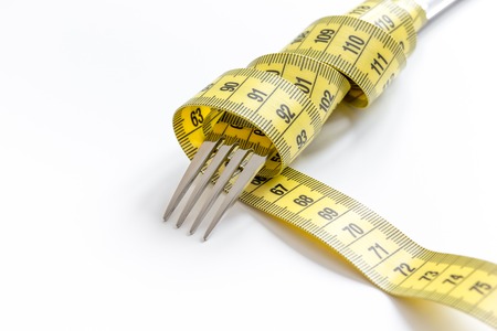 concept diet and weight loss on white background close upの写真素材