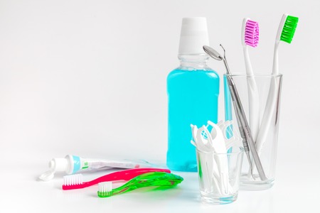 toothbrushes in glass on white background tools for oral care.の写真素材