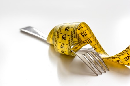 concept diet and weight loss on white background close upの写真素材