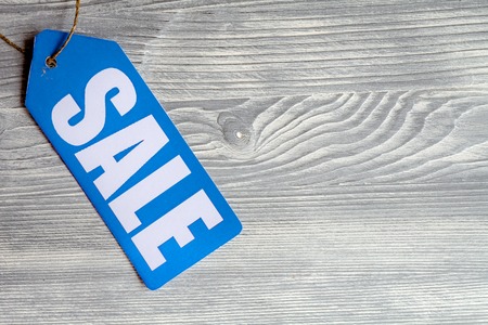 concept of sale on wooden background top view.の写真素材