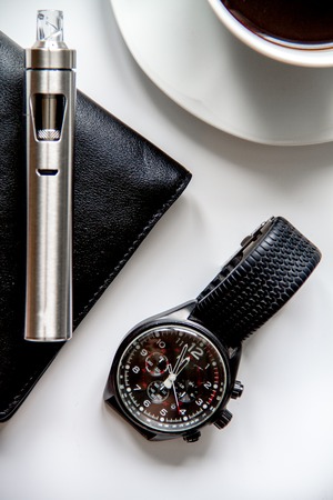smartphone, electronic cigarette and men's accessories top view.の写真素材