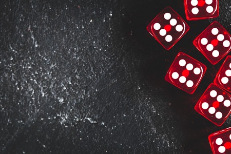 risk concept - playing dice at dark background top viewの写真素材