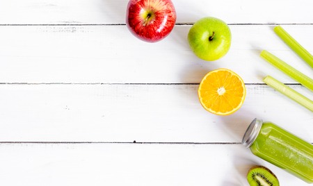 freshly squeezed juices for detox on wooden background top view.の写真素材