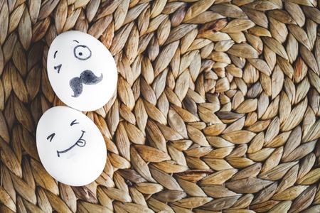 concept social networks communication and emotions - eggs on mat top view