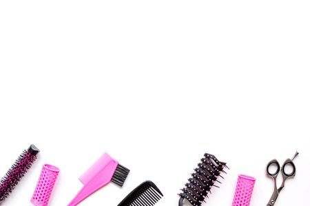 Tools for hair styling on white background top view.