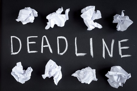 deadline concept on dark background top view.