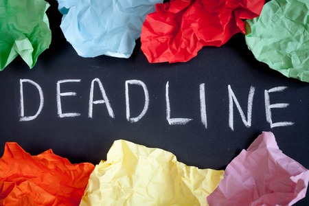 deadline concept on dark background top view.