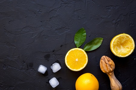 freshly squeezed orange juice on dark background top view.