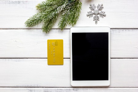 online shopping christmas with e-tablet at wooden background top viewの写真素材