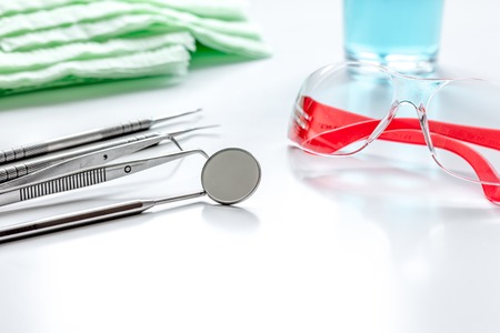 dentists tools in cabinet on white desktop close upの写真素材