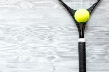 tennis racket on wooden background top view.の写真素材