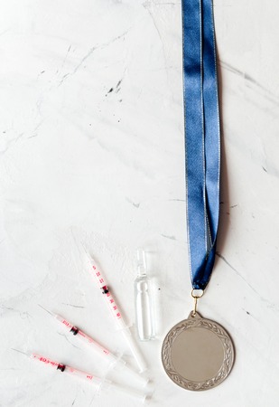 Concept of doping in sport - deprivation medals top view.の写真素材