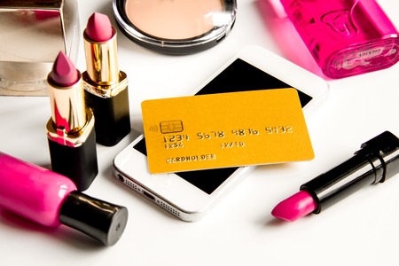 concept online shopping cosmetics on white background close upの写真素材