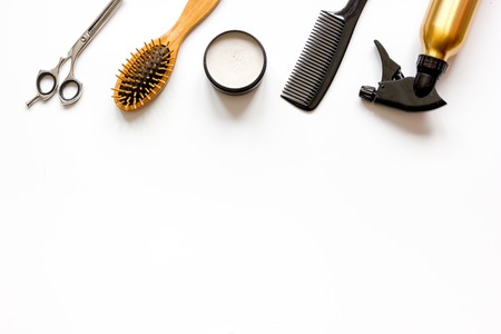 combs and hairdresser tools on white background top view.
