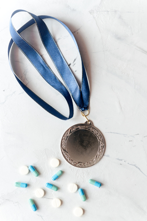 Concept of doping in sport - deprivation medals top view.の写真素材