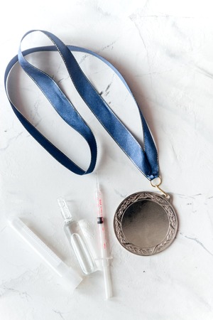 Concept of doping in sport - deprivation medals top view.の写真素材
