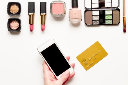 concept online shopping cosmetics on white background top view mock upの写真素材
