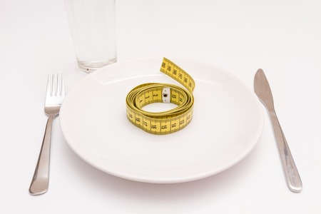 concept diet fresh vegetables on plate at white background.の写真素材