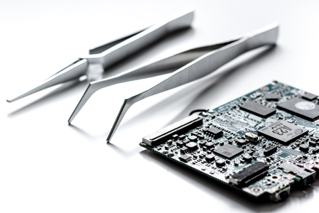 concept repair smartphone with parts of digital gadgets with tools on white background close upの写真素材