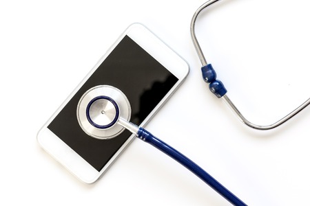 diagnostic of gadgets on white background with stethoscope.