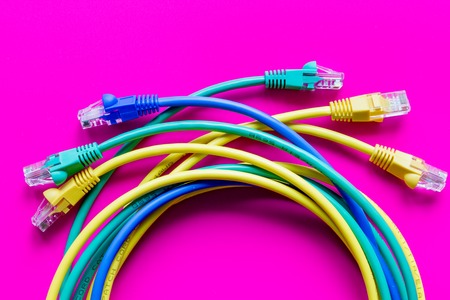 concept network internet cable on pink background close up.の写真素材