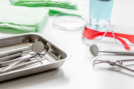 dentists tools in cabinet on white desktop close upの写真素材