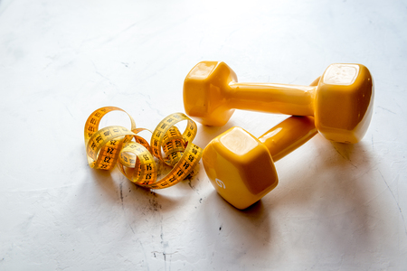 concept preparing to fitness sports equipment on gray backgroundの写真素材