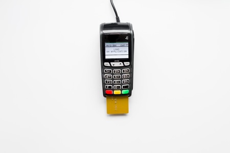 payment terminal with card on white background top view.の写真素材
