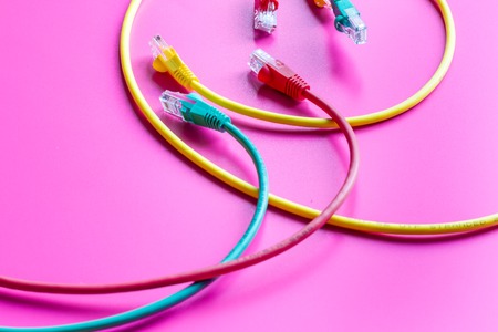 concept network internet cable on pink background close up.の写真素材