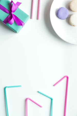 Gift box with colorful party items on white background top view mock upの写真素材