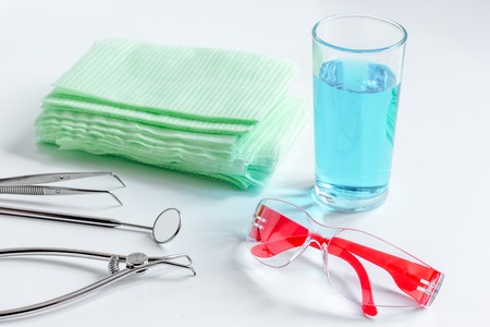 dentists tools in cabinet on white desktop close upの写真素材