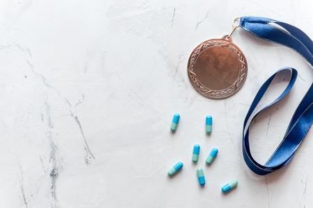 Concept of doping in sport - deprivation medals top view.の写真素材