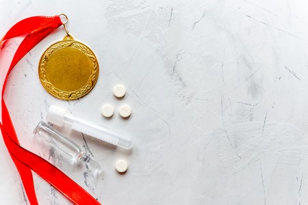 Concept of doping in sport - deprivation medals top view.の写真素材