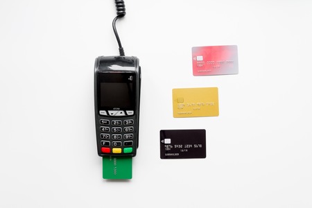 payment terminal with card on white background top view.の写真素材