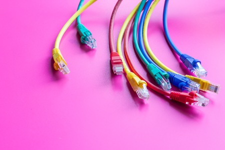 concept network internet cable on pink background close up.の写真素材