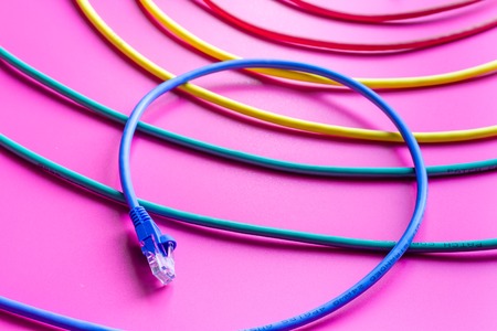 concept network internet cable on pink background close up.の写真素材