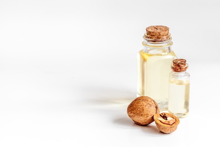 cosmetic and therapeutic walnut oil on white background.