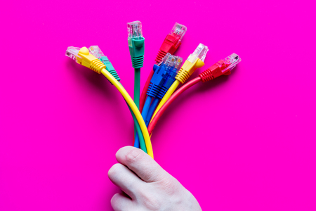 concept network internet cable on pink background close up.の写真素材