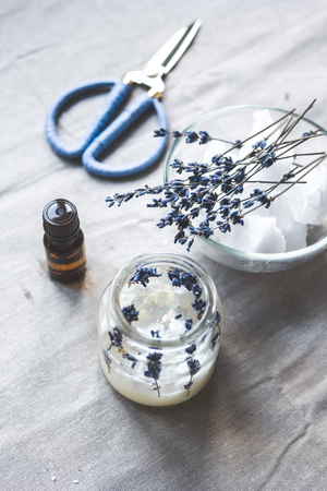 handmade candles with lavender on textile background.の写真素材
