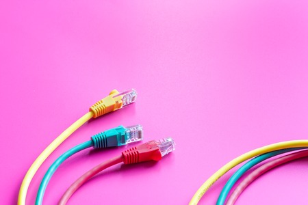concept network internet cable on pink background close up.の写真素材