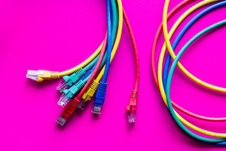 concept network internet cable on pink background close up.の写真素材