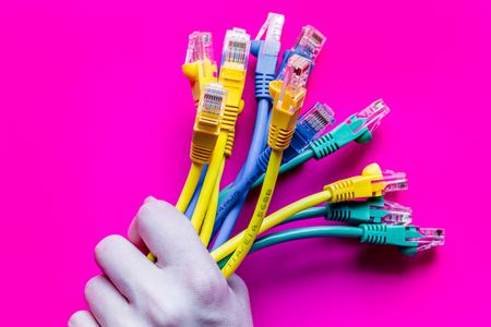 concept network internet cable on pink background close up.の写真素材