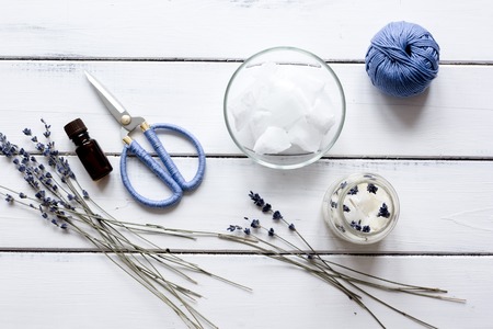 handmade candles with lavender on wooden background top view.の写真素材