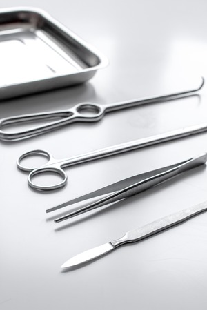 instruments for plastic surgery on white background