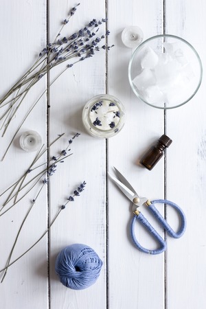 handmade candles with lavender on wooden background top viewの写真素材